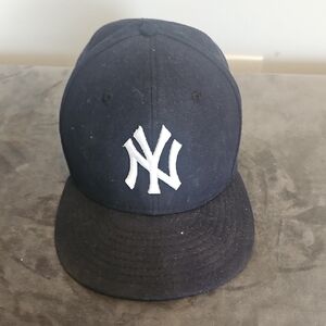 New Era Navy Cap with White NY Emblem...size 7 and 3 Quarters